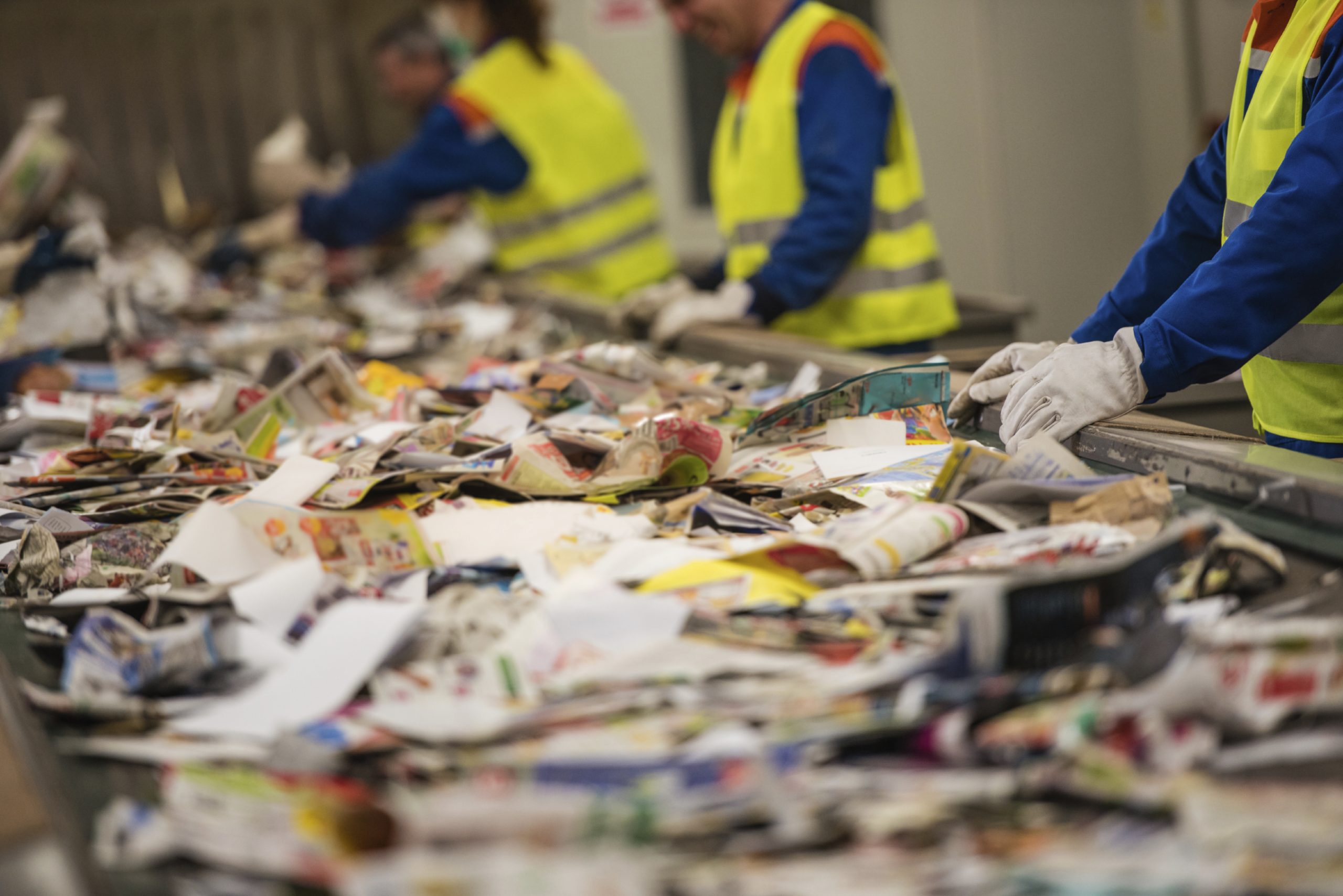 A conveyor belt filled with waste paper recycling