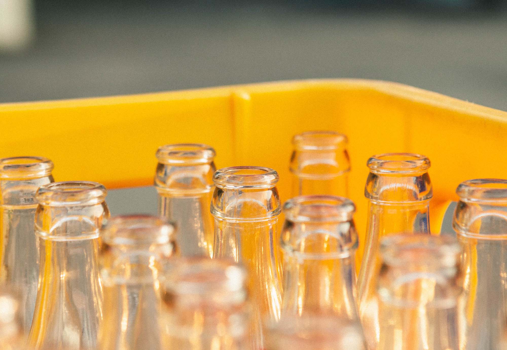 Extreme close-up of empty clear glass bottles