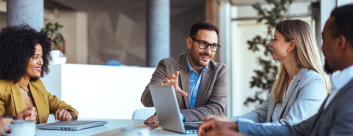 Reasons to join a compliance scheme illustrated by business team in discussion.