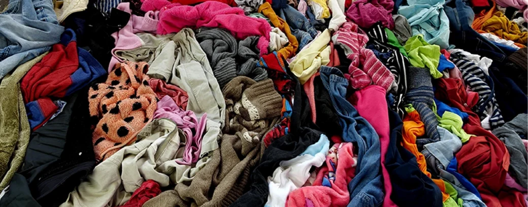 Pile of clothes illustrating textiles recycling.