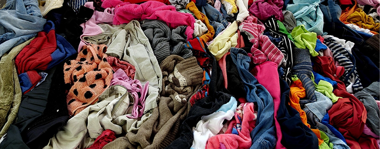 Pile of clothes illustrating textiles recycling.